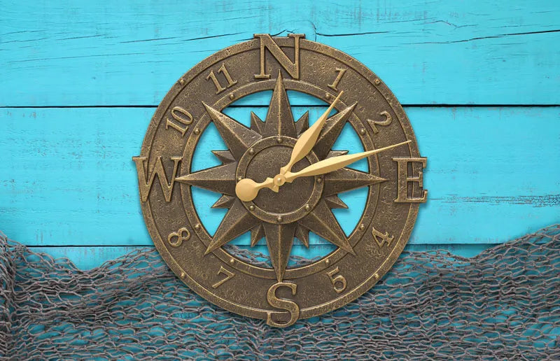 Whitehall Compass Rose clock against blue wood with nautical net detail